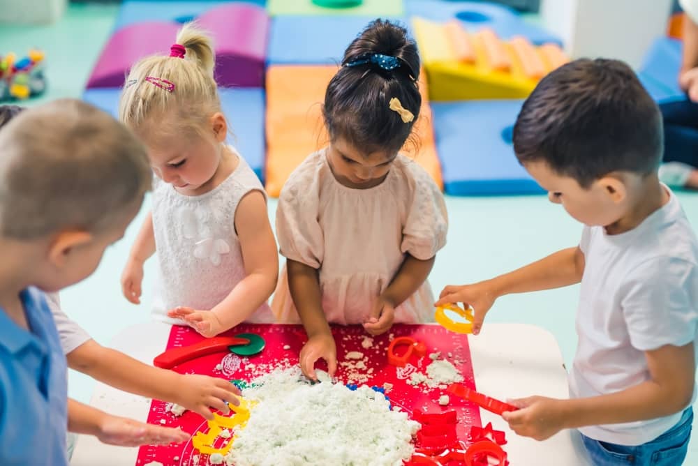 Children playing with kinetic sand encourages one of the four different children's learning styles
