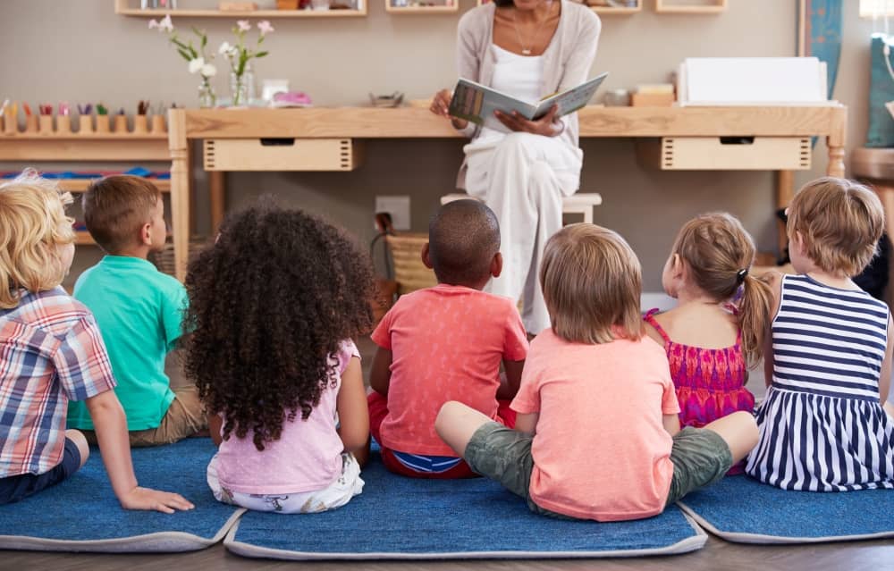 Teaching reading to children during story time.